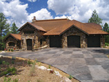 Exterior of mountain rustic home by Harmony Builders